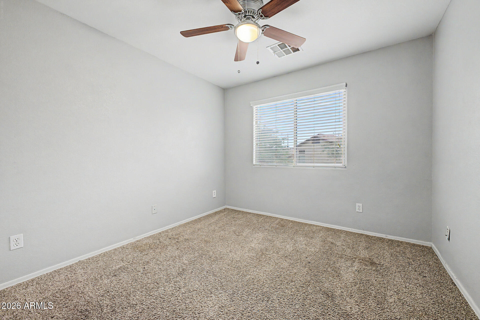 1379 East Joseph Way Gilbert, AZ 85295 - Photo 24 of 44 an empty room with a window and a fan