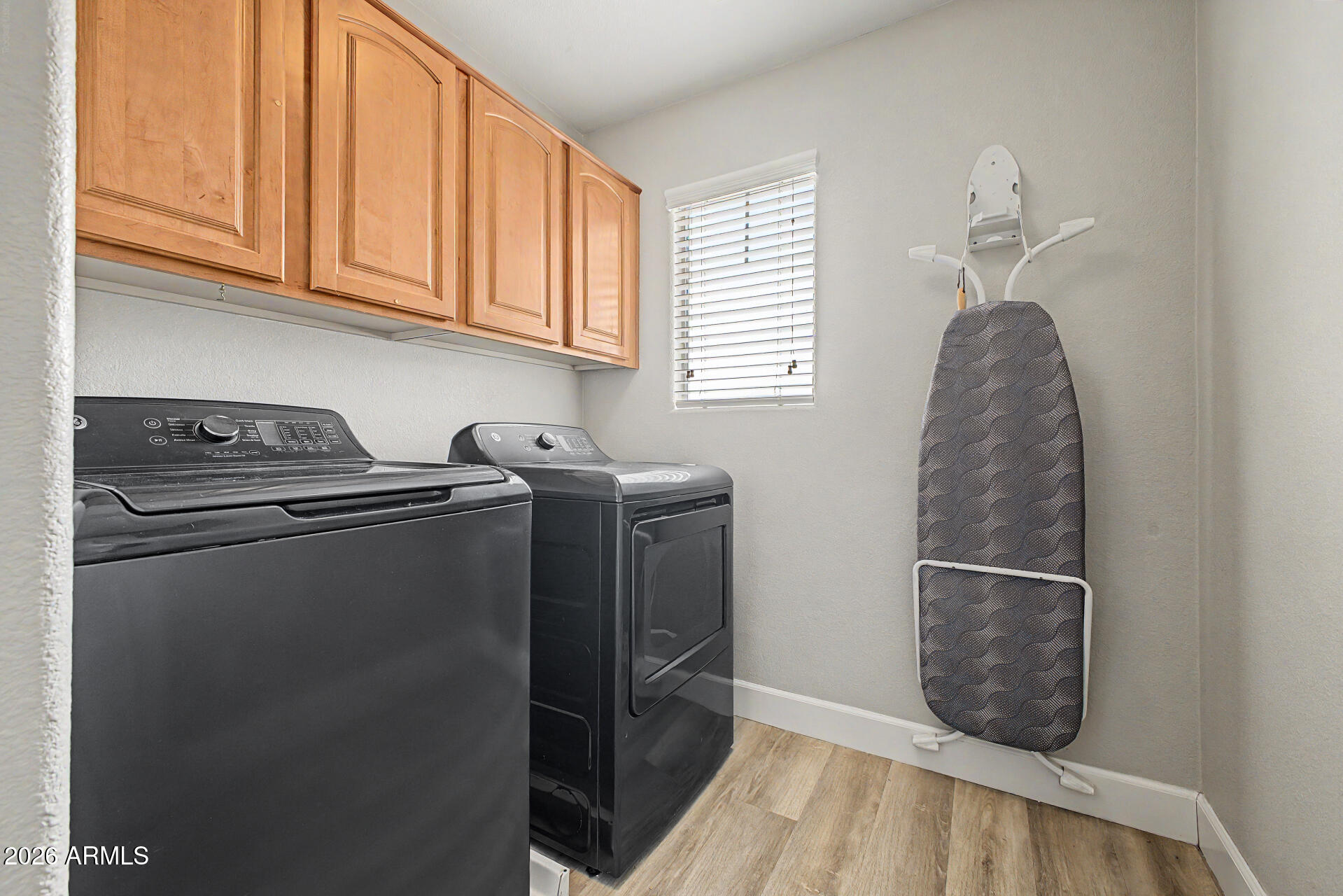 1379 East Joseph Way Gilbert, AZ 85295 - Photo 26 of 44 a kitchen with a refrigerator and cabinets