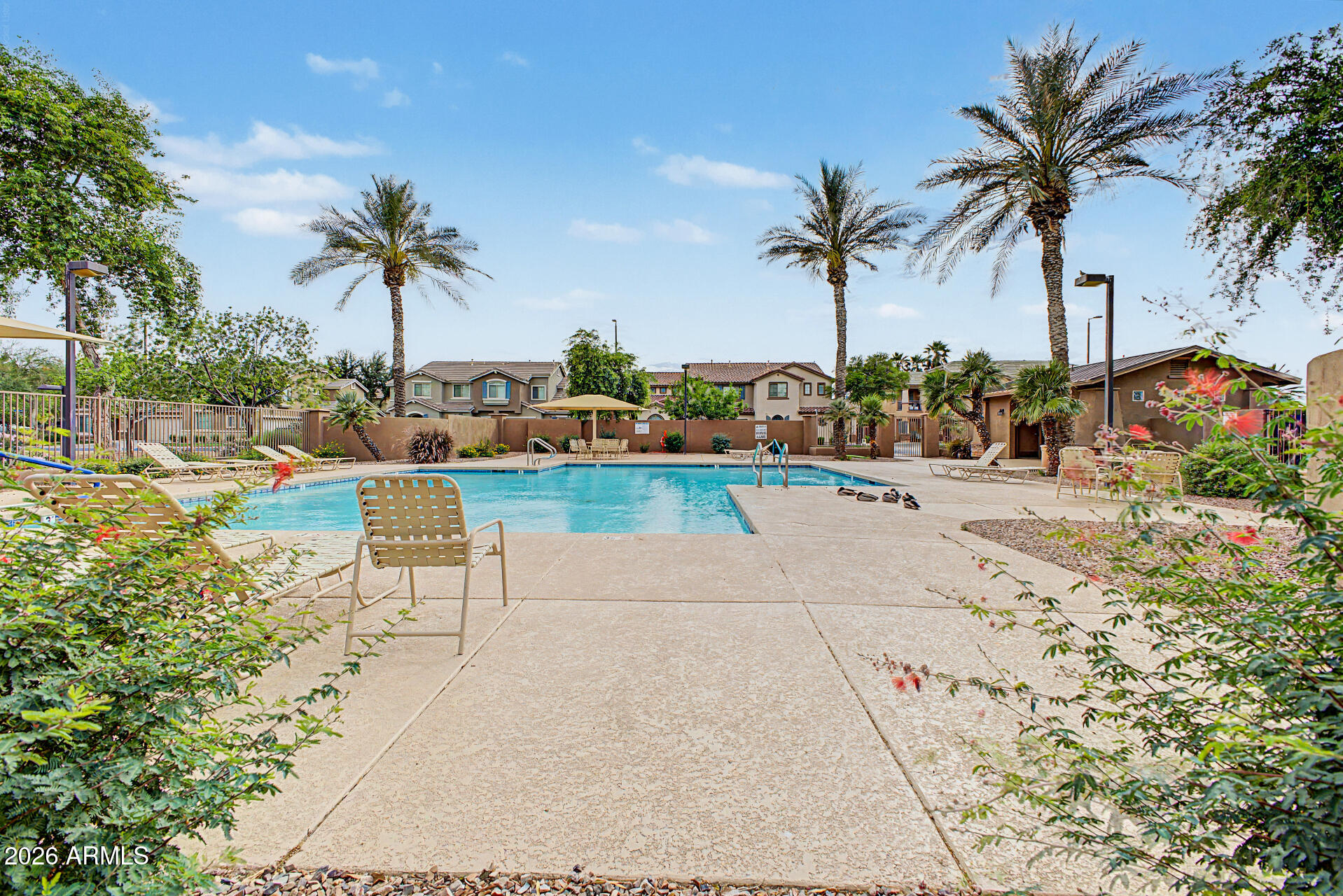 1379 East Joseph Way Gilbert, AZ 85295 - Photo 34 of 44 a view of a swimming pool with a table and chairs