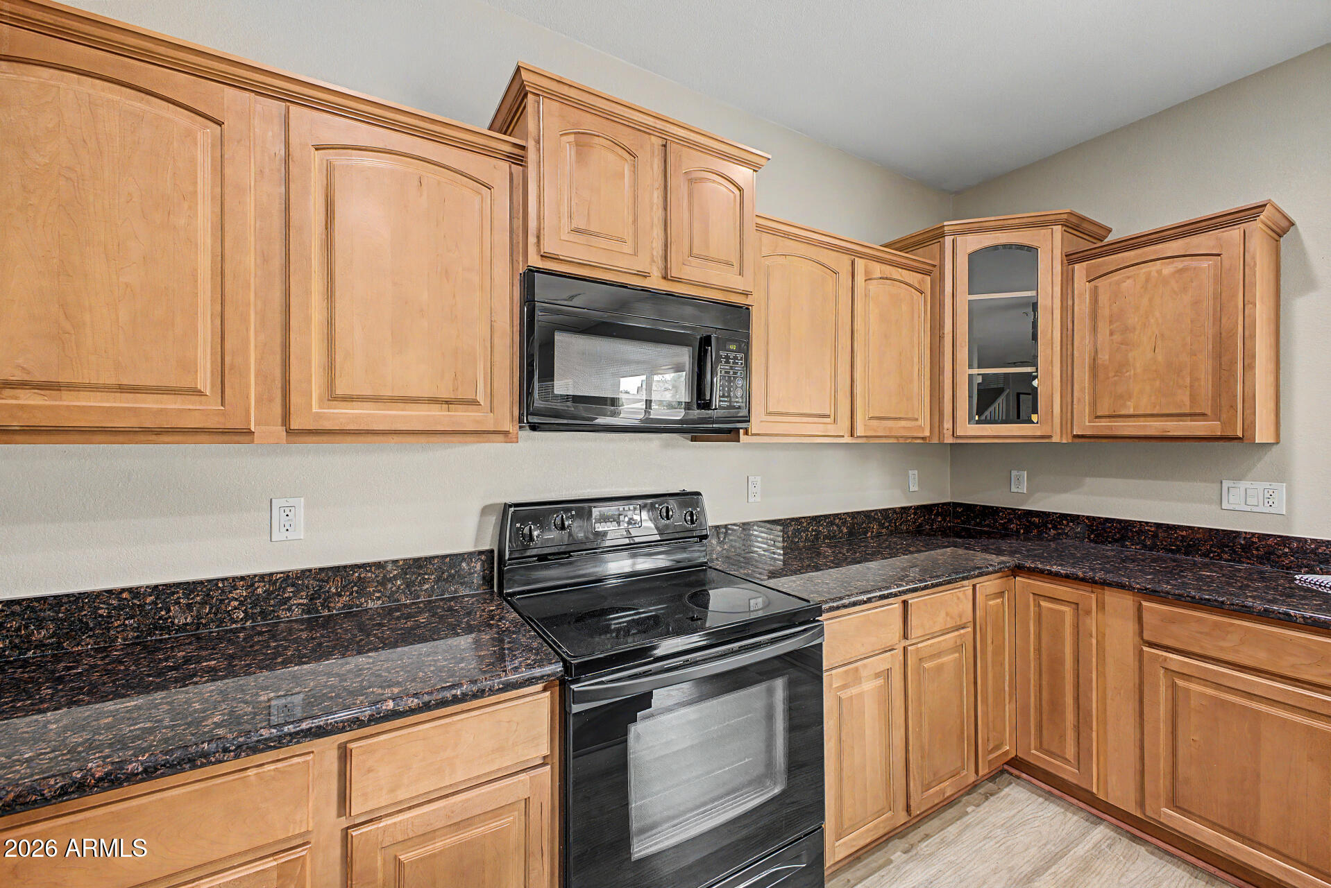 1379 East Joseph Way Gilbert, AZ 85295 - Photo 8 of 44 a kitchen with stainless steel appliances granite countertop white cabinets granite counter tops and a wooden floors