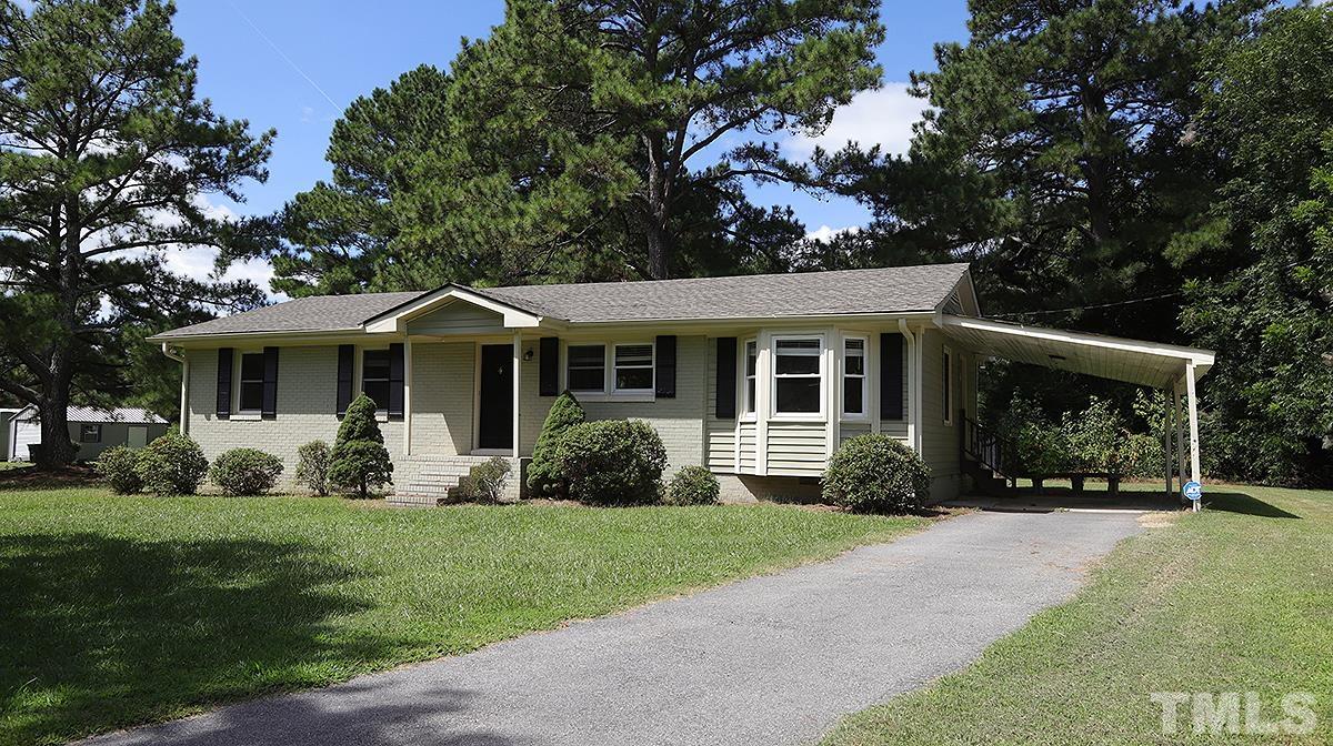 4101 Edgemont Road Wendell, NC 27591 - Photo 1 of 12 a front view of a house with garden and porch