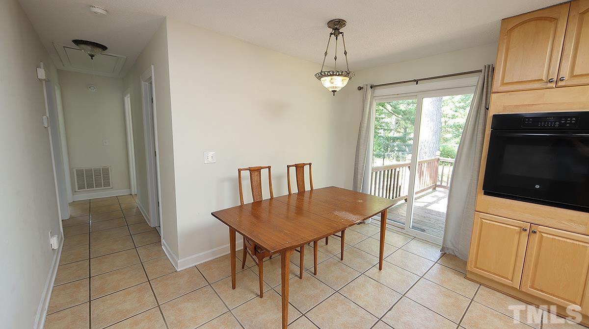 4101 Edgemont Road Wendell, NC 27591 - Photo 3 of 12 a view of a room with furniture and wooden floor