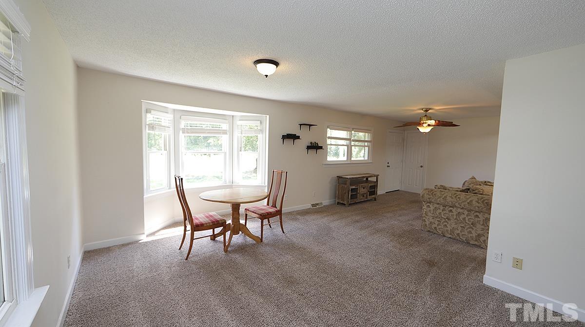 4101 Edgemont Road Wendell, NC 27591 - Photo 5 of 12 a view of a livingroom with furniture and windows