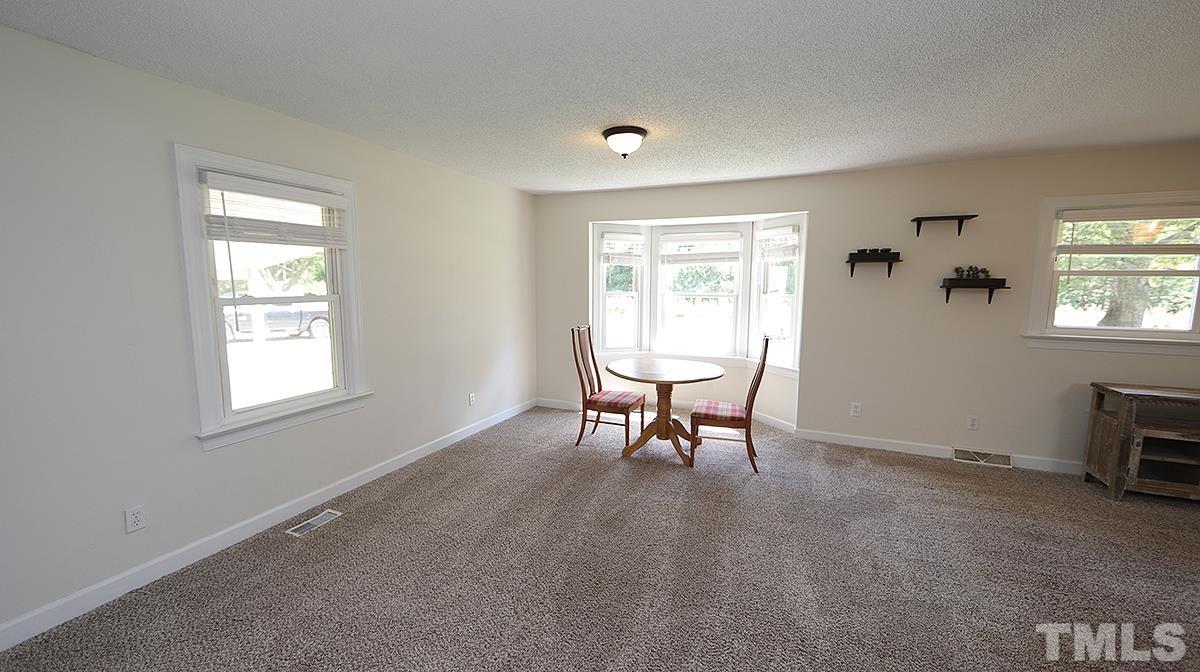4101 Edgemont Road Wendell, NC 27591 - Photo 6 of 12 a view of a livingroom with furniture and a window