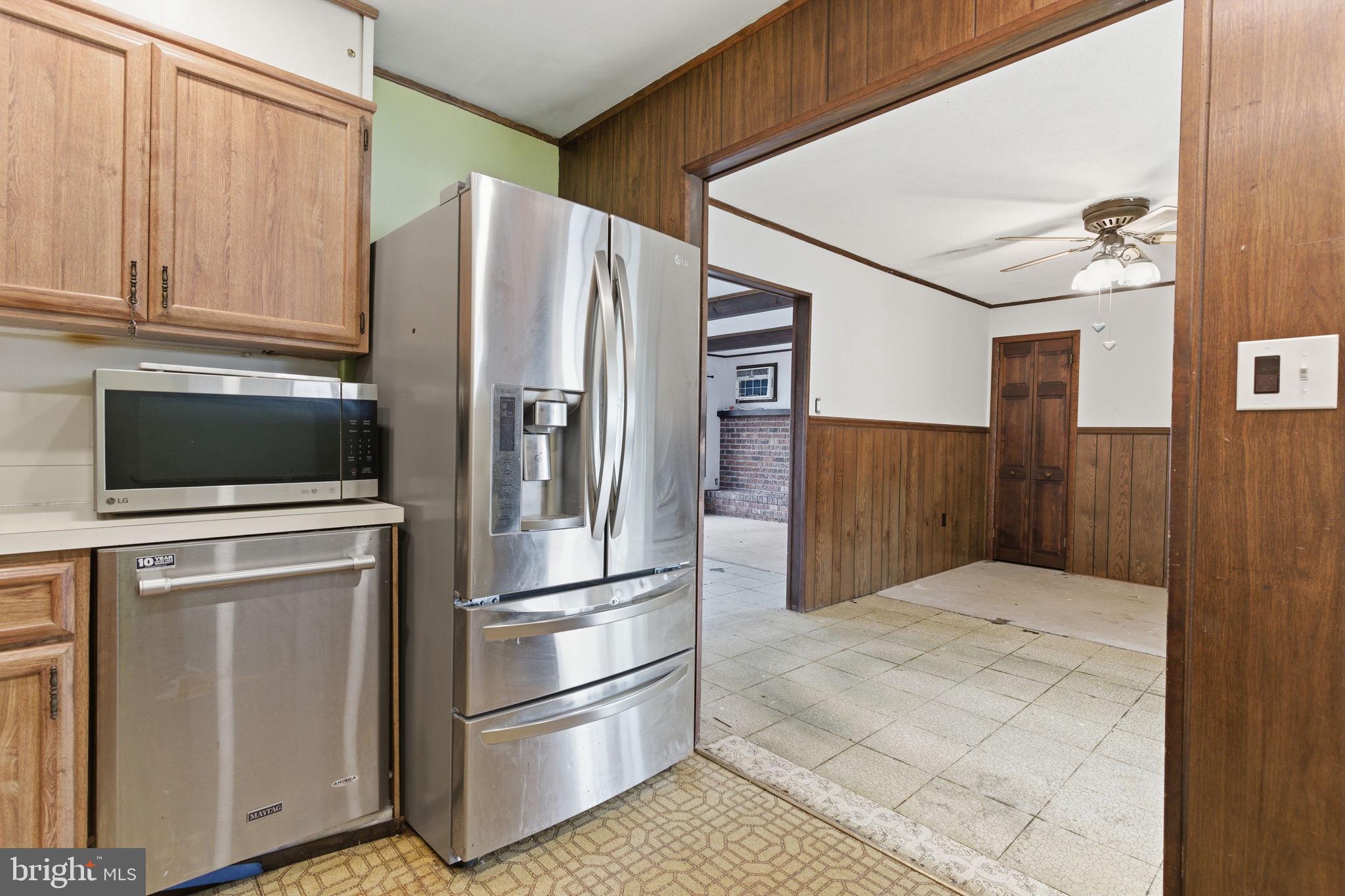 28 Cloister Road Levittown, PA 19057 - Photo 11 of 28 a kitchen with stainless steel appliances a refrigerator and cabinets