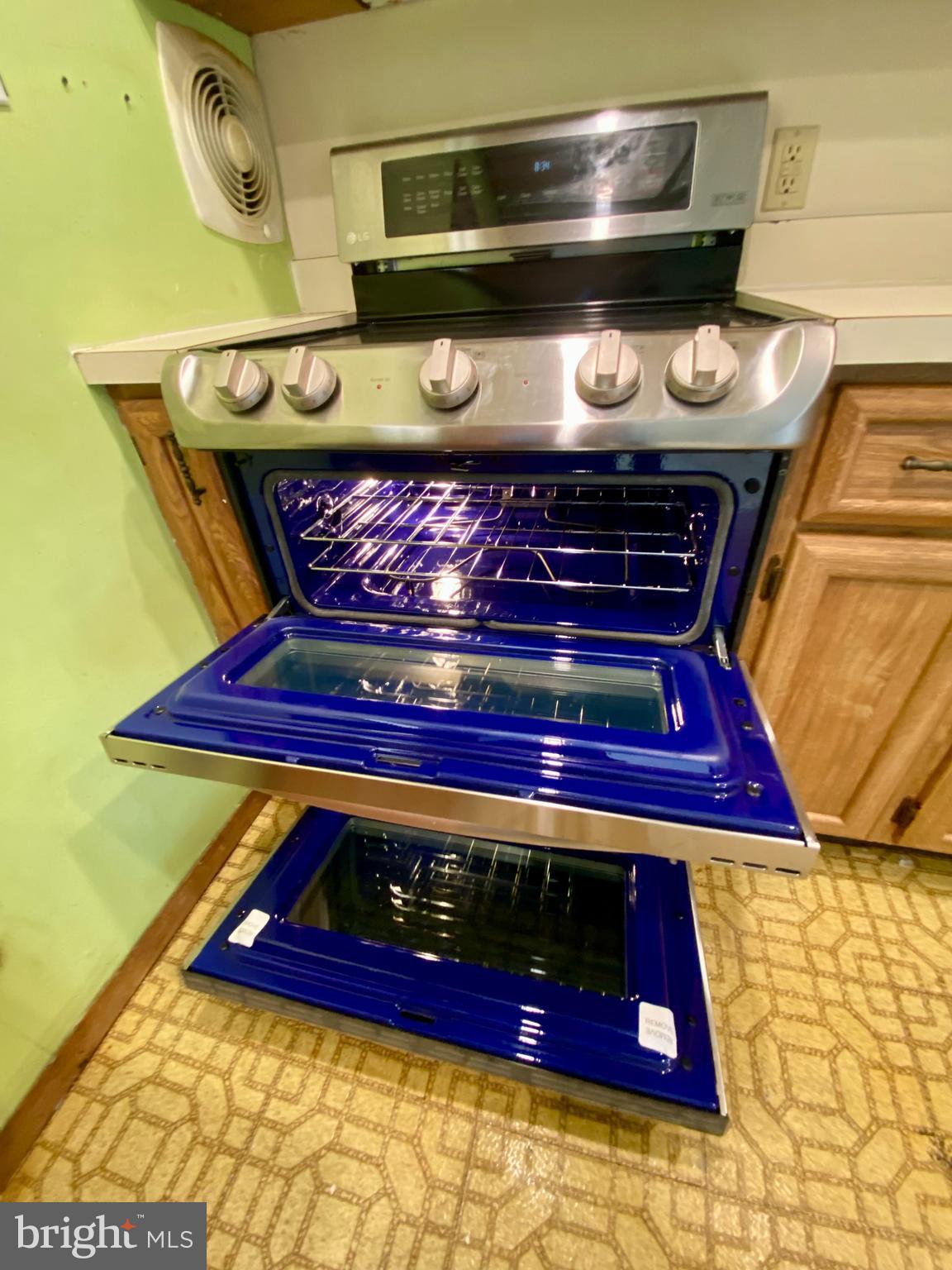 28 Cloister Road Levittown, PA 19057 - Photo 13 of 28 a stove top oven sitting inside of a kitchen