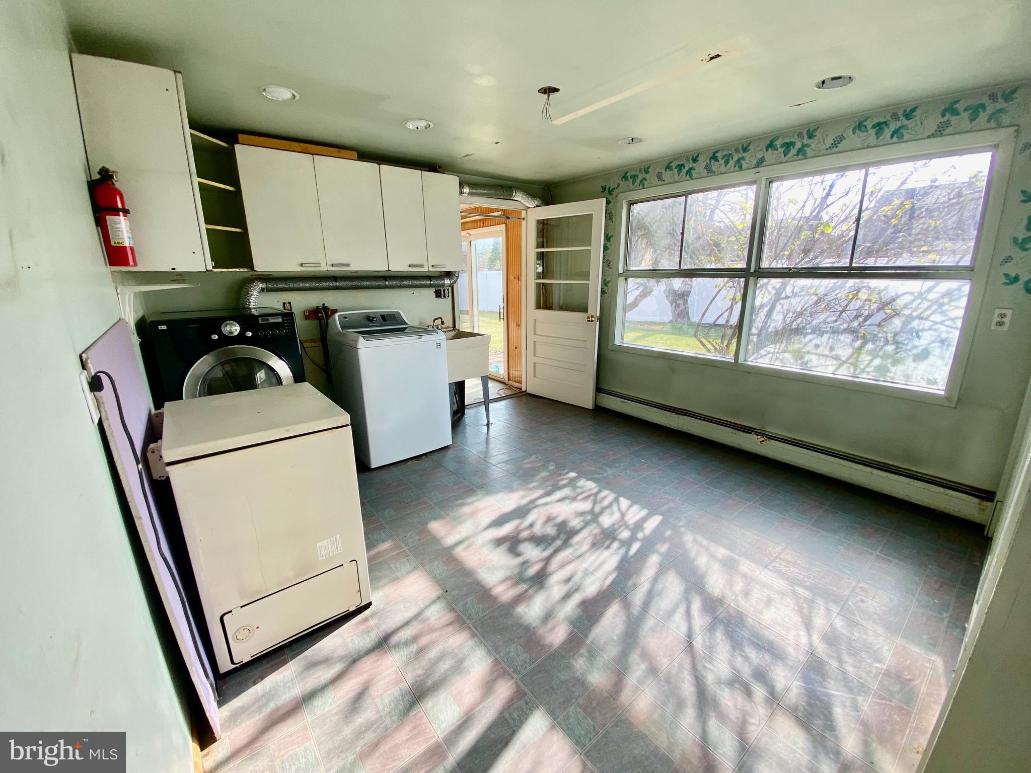 28 Cloister Road Levittown, PA 19057 - Photo 17 of 28 a kitchen with a refrigerator and a sink
