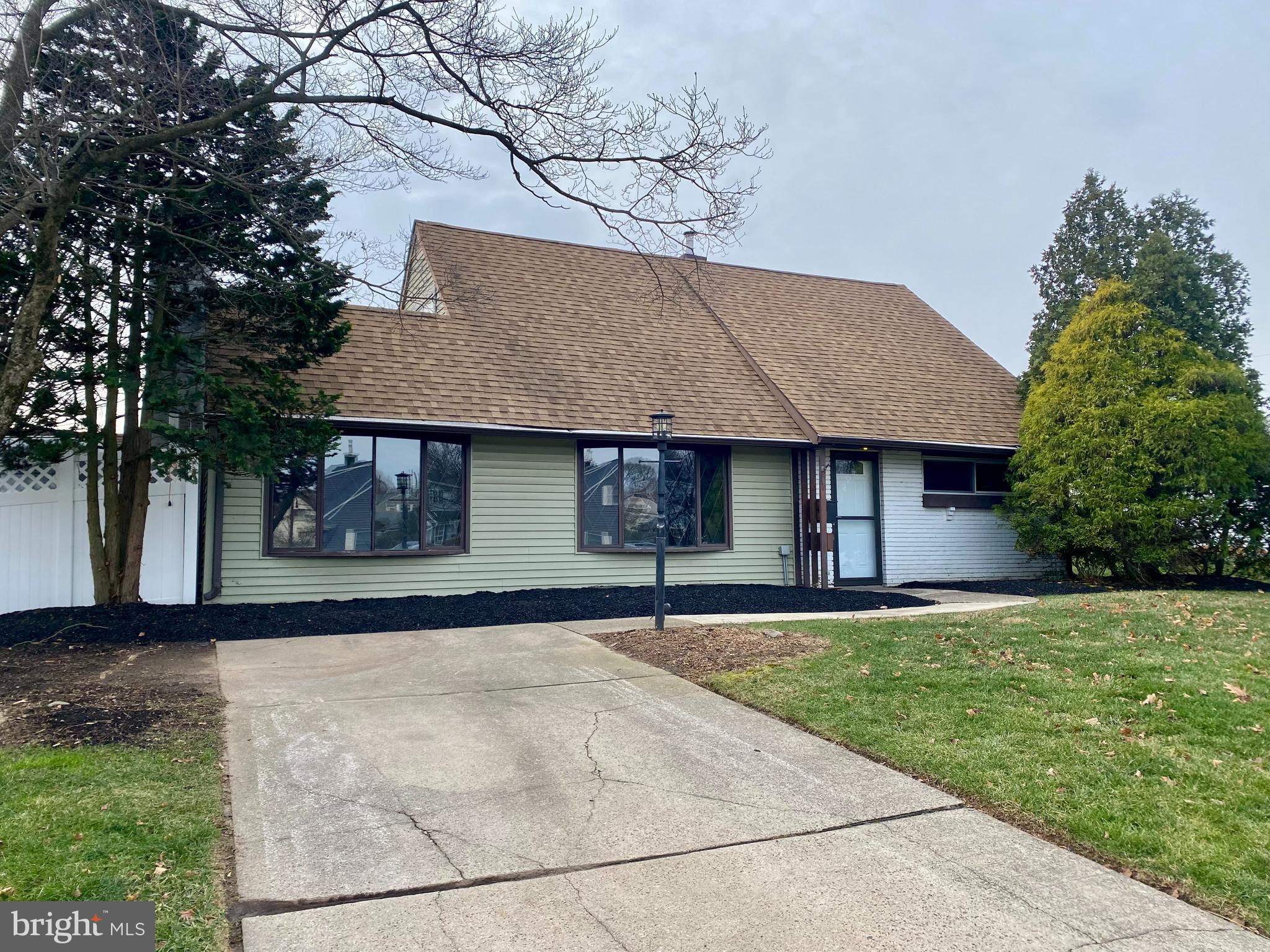 28 Cloister Road Levittown, PA 19057 - Photo 2 of 28 a front view of a house with a yard and garage