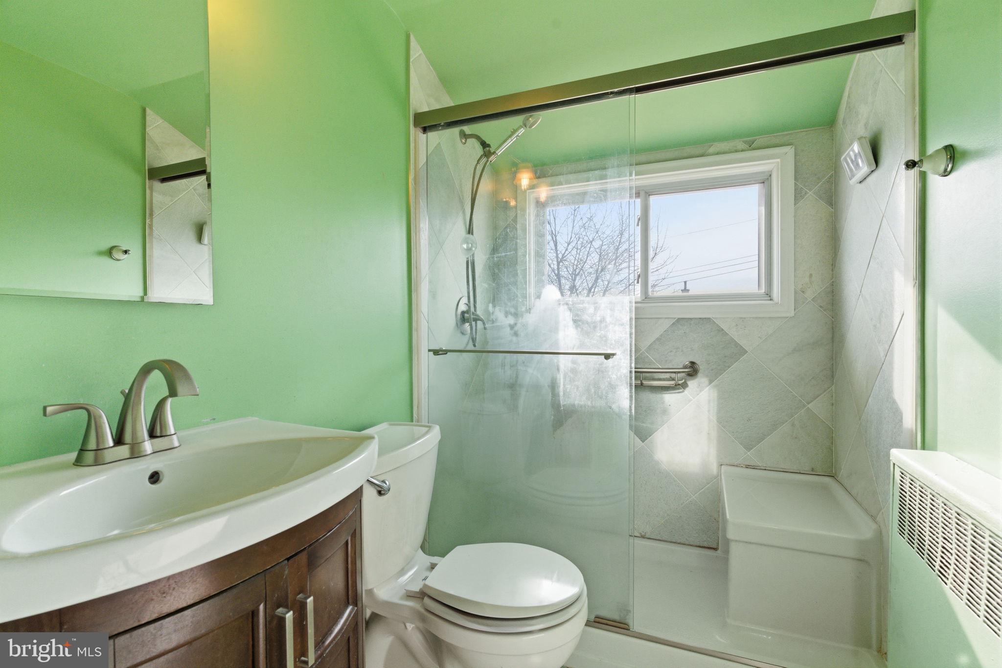 28 Cloister Road Levittown, PA 19057 - Photo 21 of 28 a bathroom with a sink a toilet and shower
