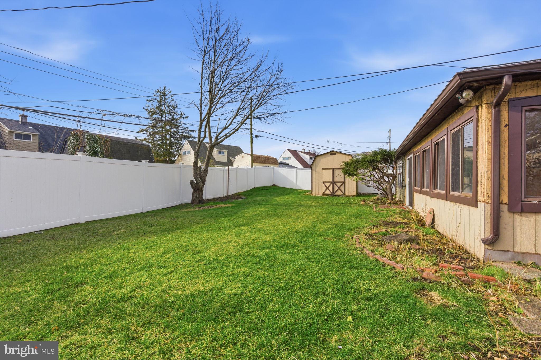 28 Cloister Road Levittown, PA 19057 - Photo 25 of 28 a view of a house with a back yard
