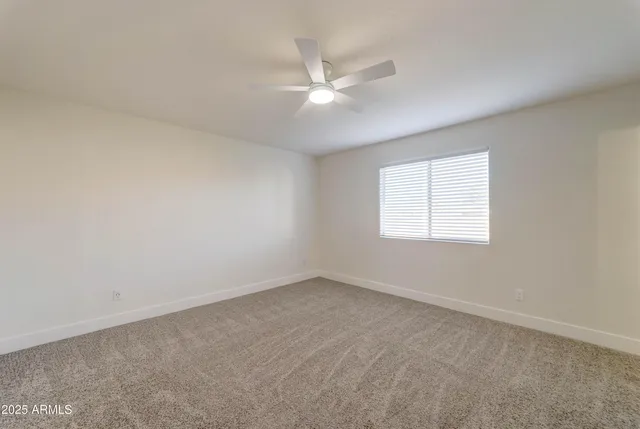 a view of an empty room and closet area