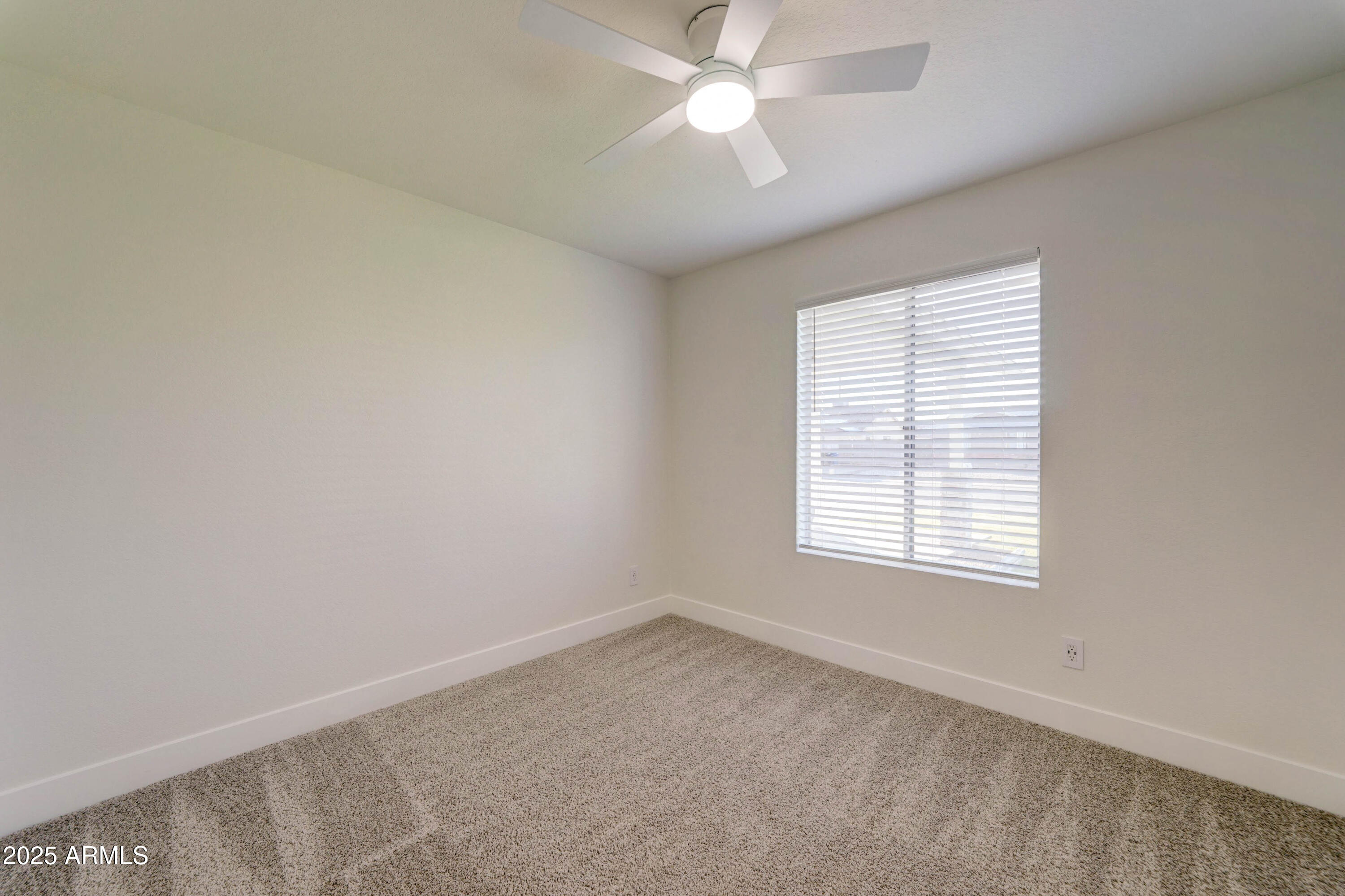 324 West Harvard Avenue Gilbert, AZ 85233 - Photo 17 of 27 an empty room with a window and a fan