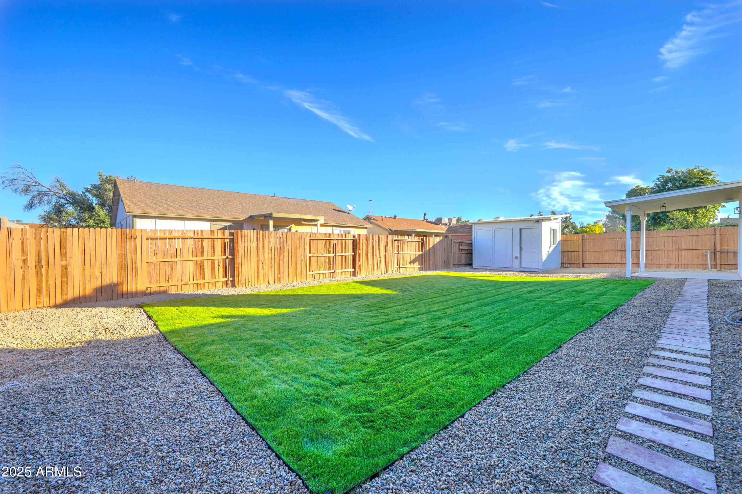 324 West Harvard Avenue Gilbert, AZ 85233 - Photo 24 of 27 a view of a house with a yard