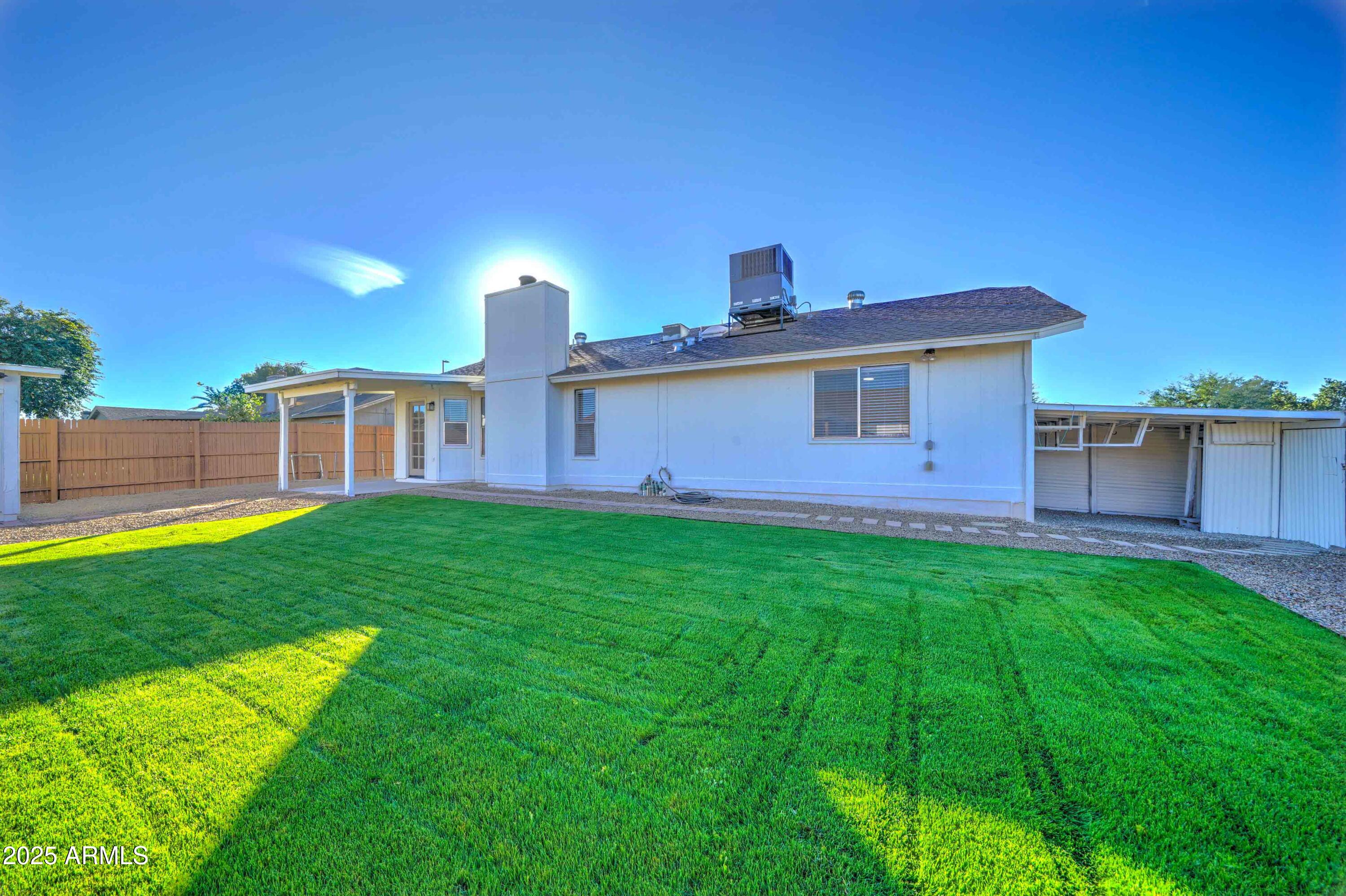 324 West Harvard Avenue Gilbert, AZ 85233 - Photo 25 of 27 a front view of a house with a garden