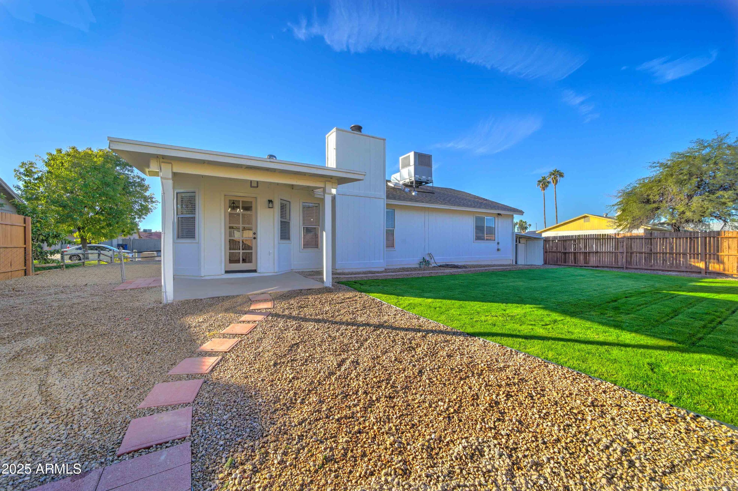 324 West Harvard Avenue Gilbert, AZ 85233 - Photo 26 of 27 a view of a house with a yard