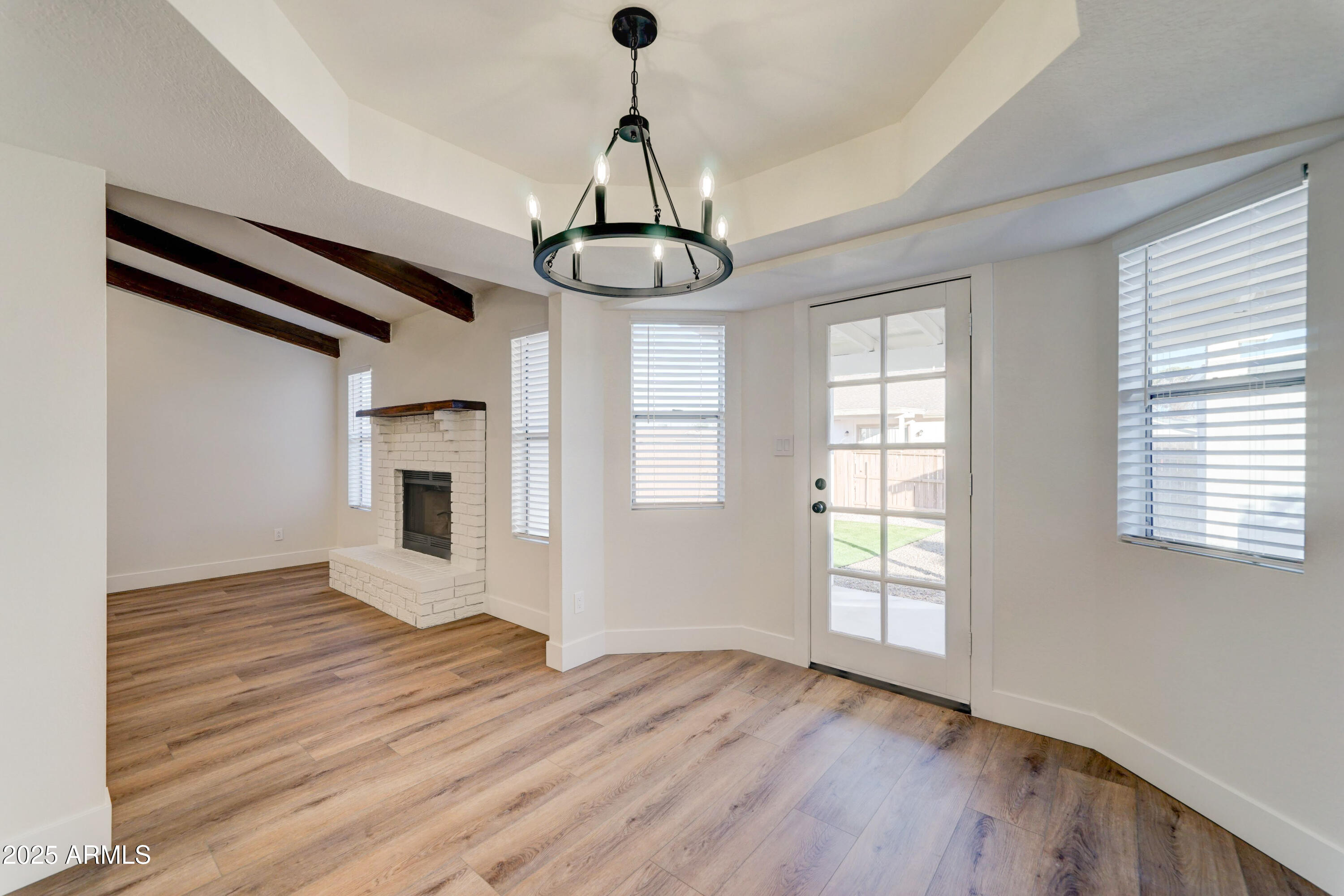 324 West Harvard Avenue Gilbert, AZ 85233 - Photo 8 of 27 a view of empty room with wooden floor and window