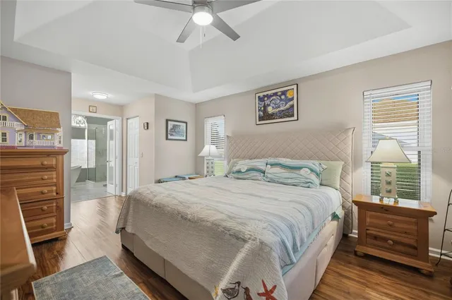 a bedroom with a bed and a television