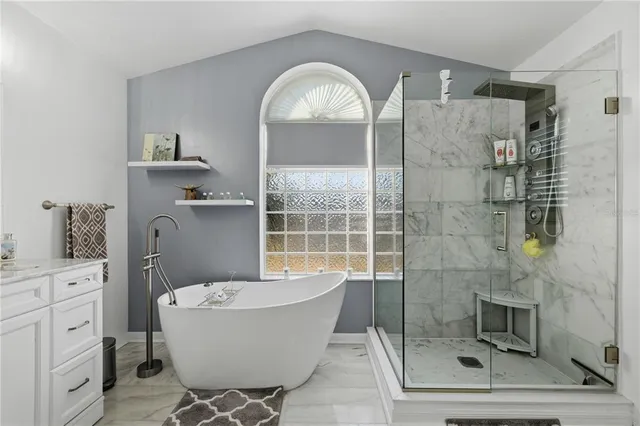 a bathroom with a bathtub and shower