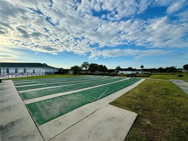 a view of a golf course with a lake