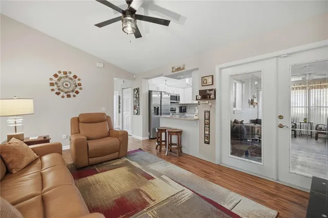 a living room with furniture and a table