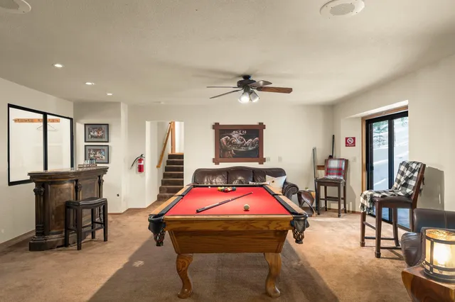 a bedroom with furniture and a chandelier