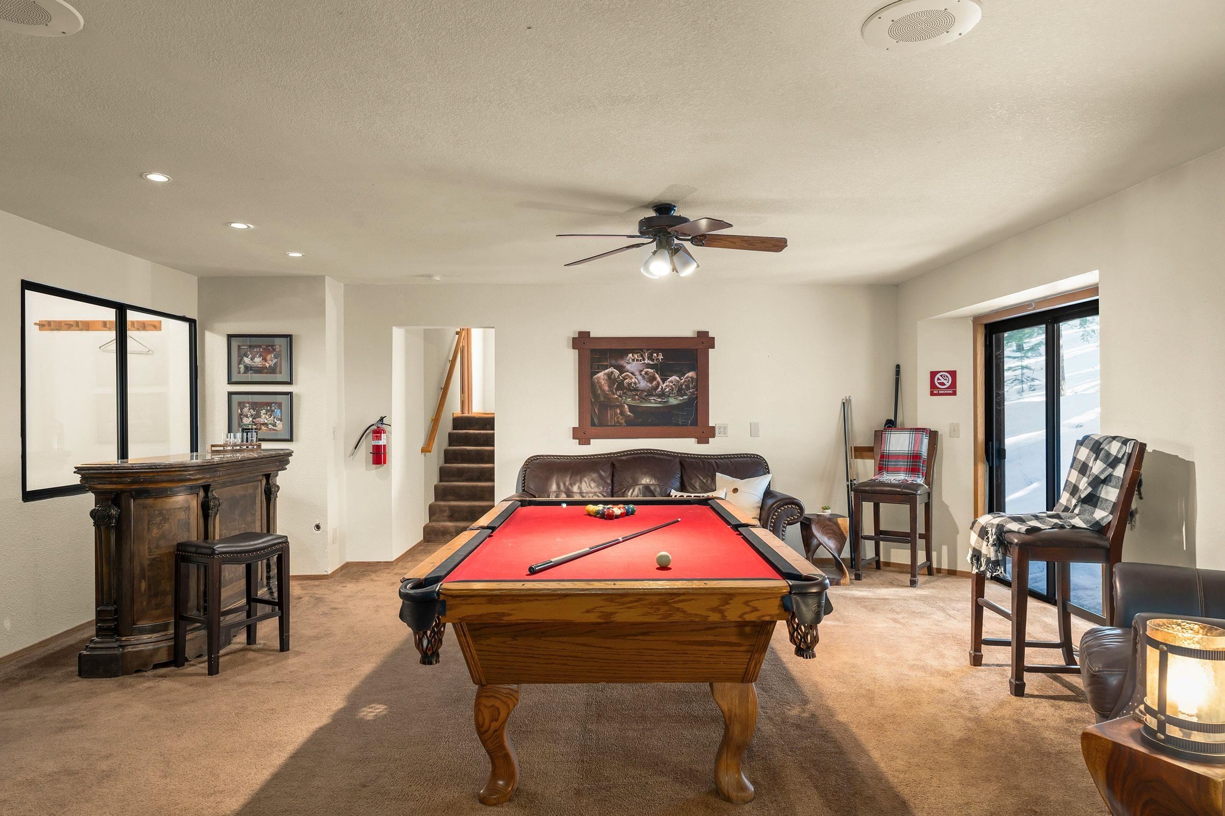 711 Conifer Truckee, CA 96161 - Photo 16 of 26 a bedroom with furniture and a chandelier