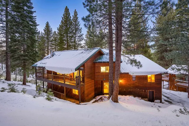 a view of a house with a yard patio and sitting area