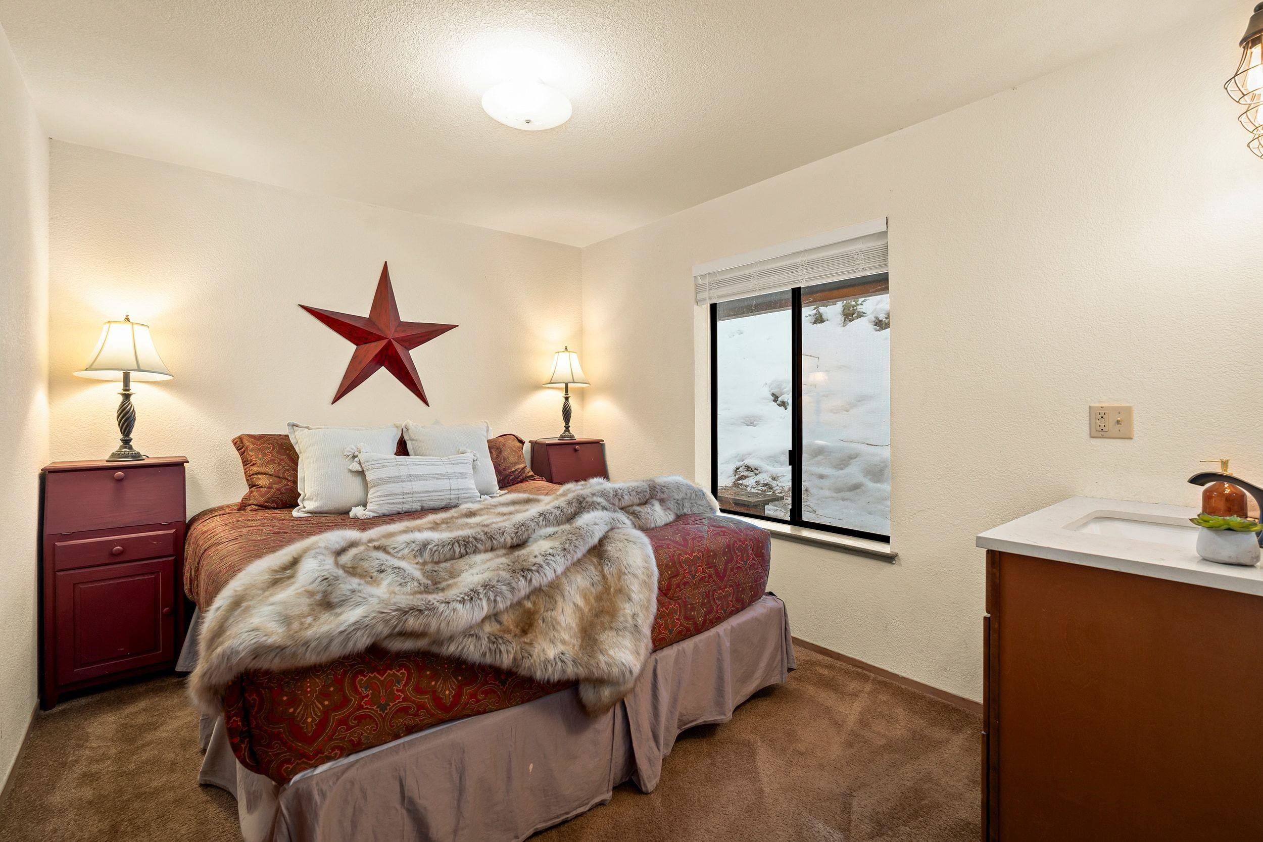 711 Conifer Truckee, CA 96161 - Photo 22 of 26 a bed sitting in a bedroom next to a window