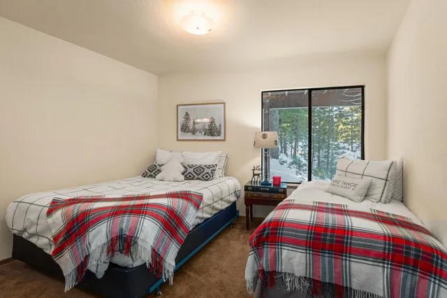 a bedroom with bed and window