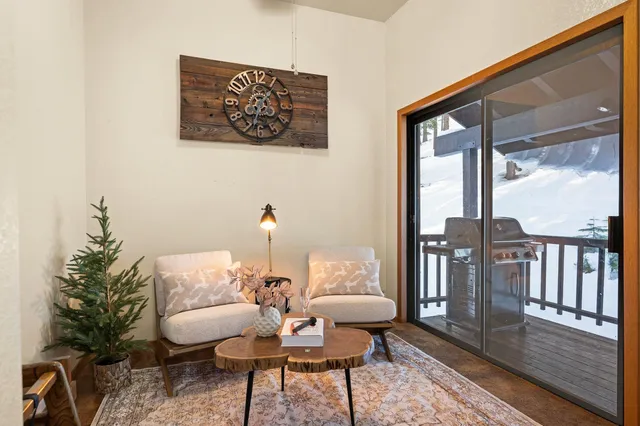 a view of a livingroom with furniture window and wooden floor