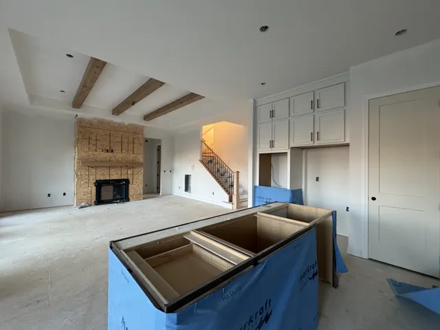 a kitchen with a sink cabinets and window