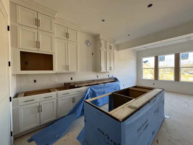 a black and white photo of a living room
