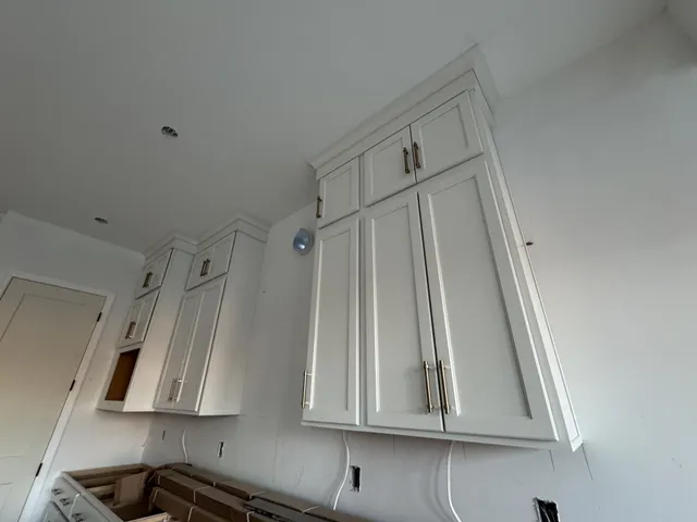 a view of a tennis ground with trees in the background