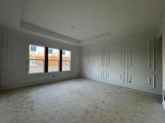a bathroom with a granite countertop toilet sink and mirror