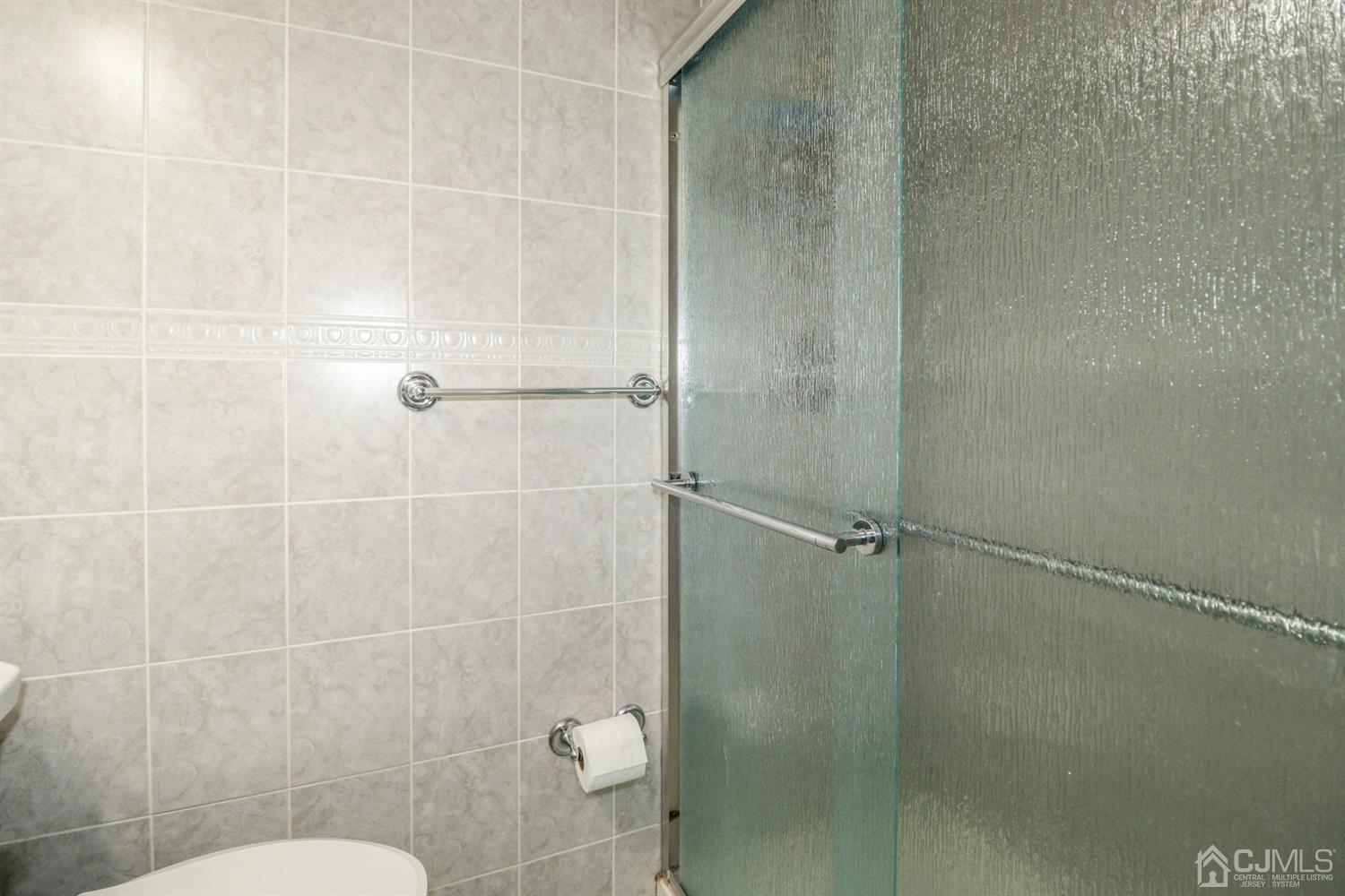 21 Kenmore Road Edison, NJ 08817 - Photo 14 of 23 a bathroom with a shower