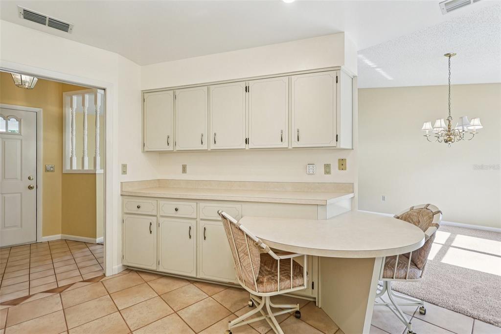 305 Brigadoon Circle Leesburg, FL 34788 - Photo 18 of 38 a kitchen with a sink cabinets and window