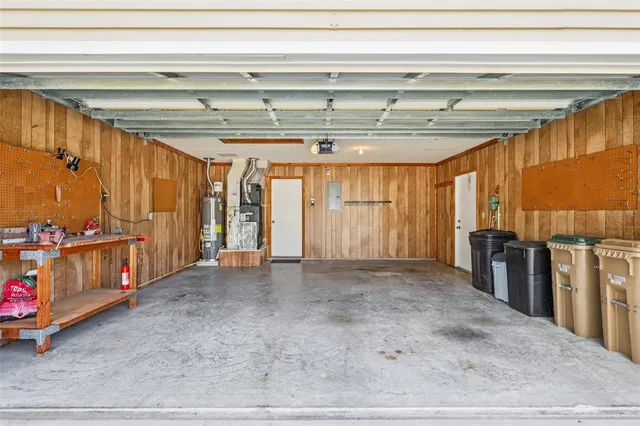 a view of a room with wooden floor and furniture