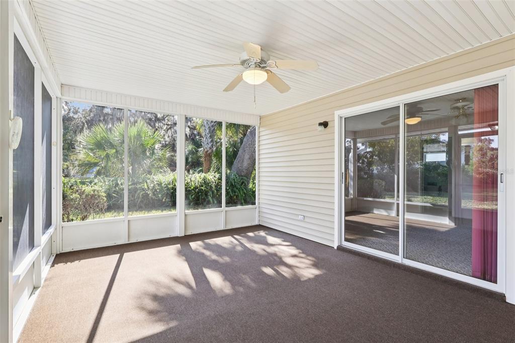 305 Brigadoon Circle Leesburg, FL 34788 - Photo 32 of 38 a view of a room with sliding windows