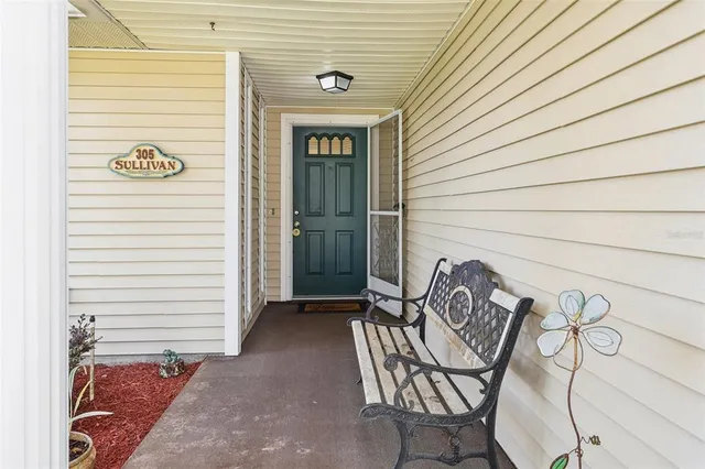 a view of a door and a microwave