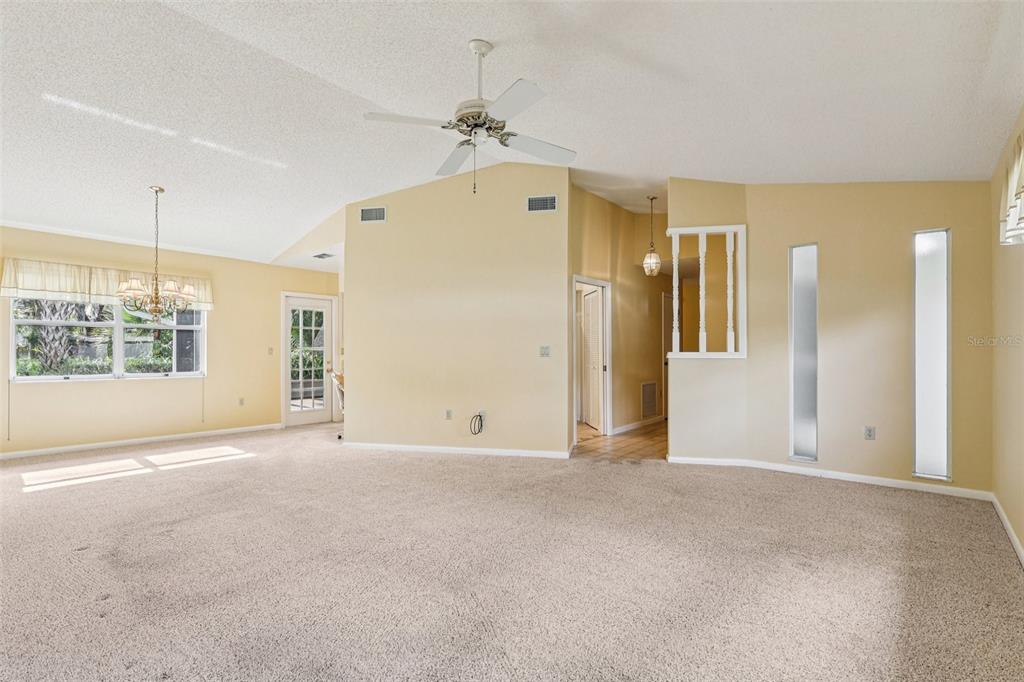 305 Brigadoon Circle Leesburg, FL 34788 - Photo 9 of 38 a view of an empty room with a window