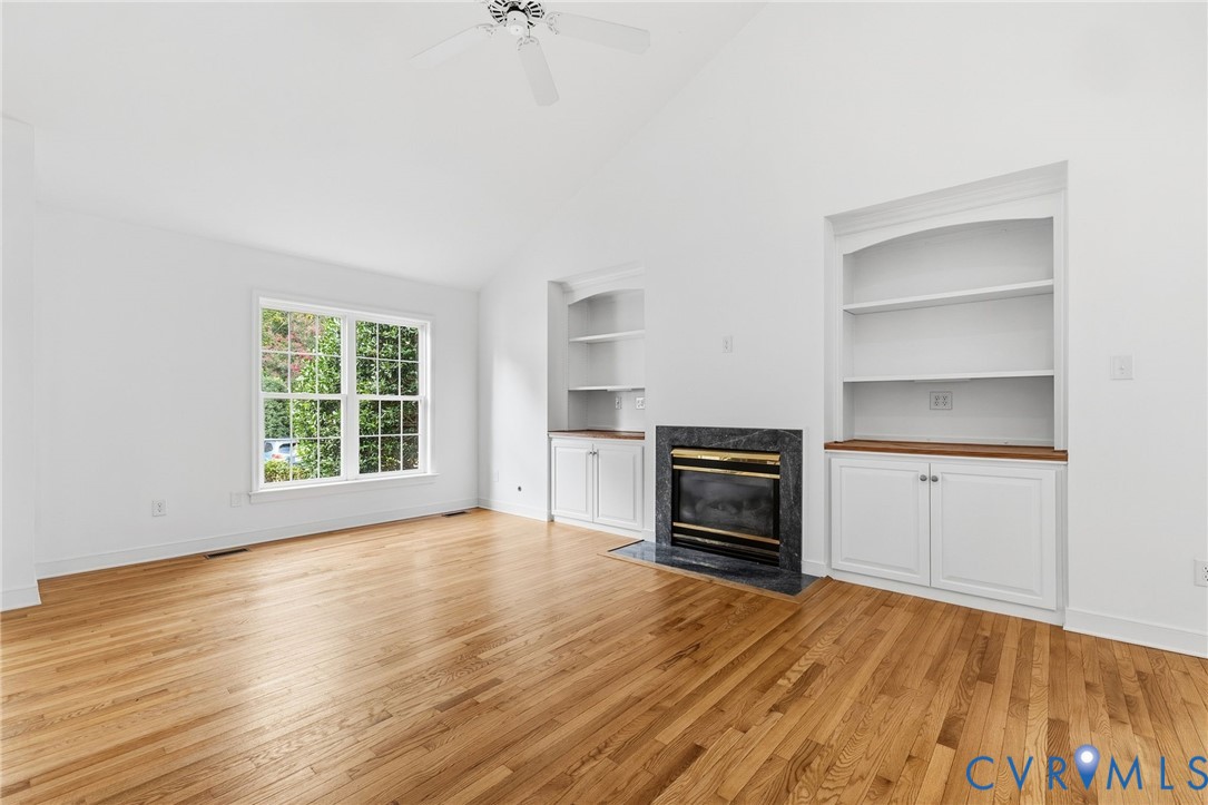 Wood-finish flooring throughout, vaulted ceiling w