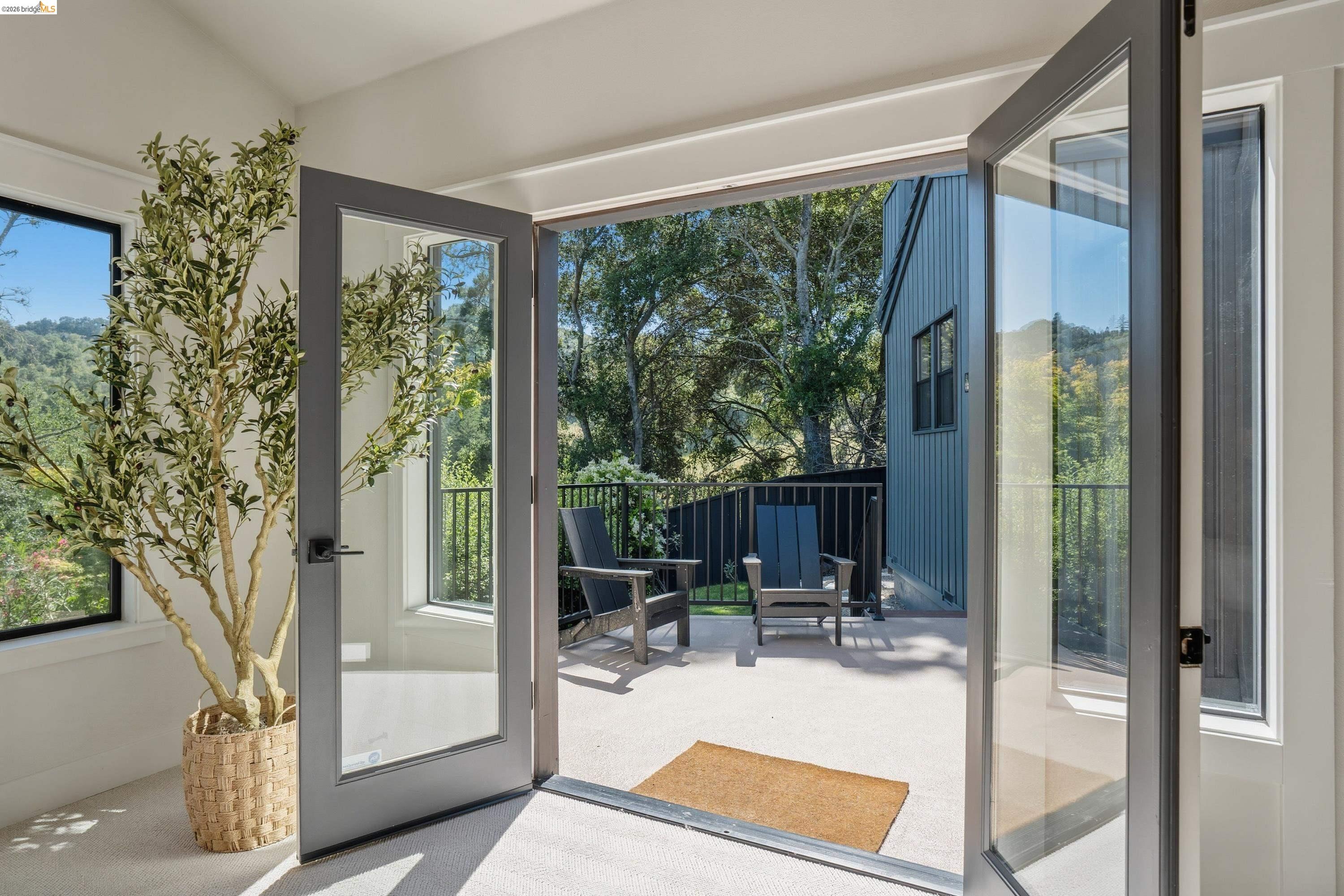 4120 Happy Valley Road Lafayette, CA 94549 - Photo 19 of 48 Full-light French doors open to a private outdoor patio with a black metal railing