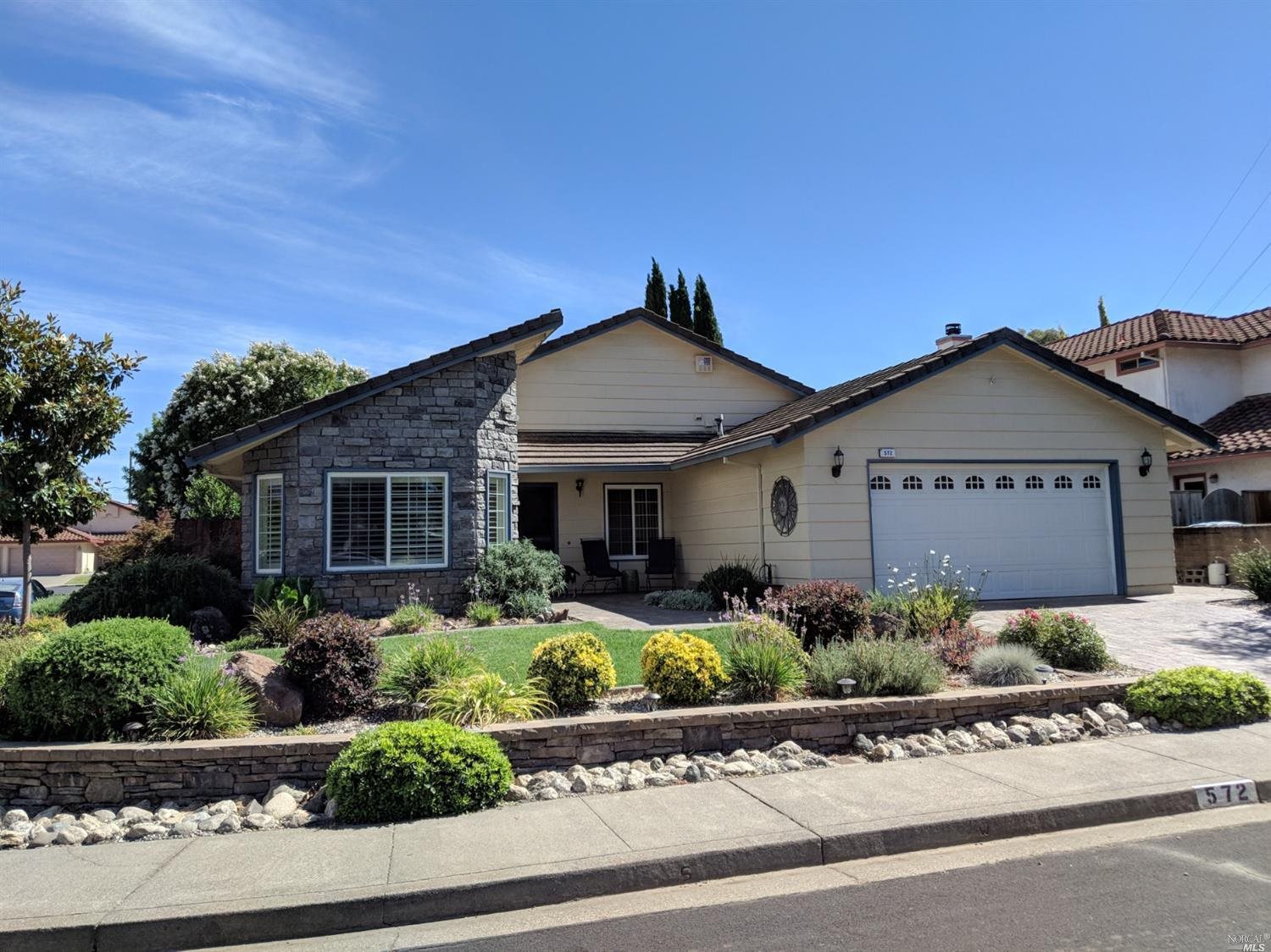 front view of a house with a bench