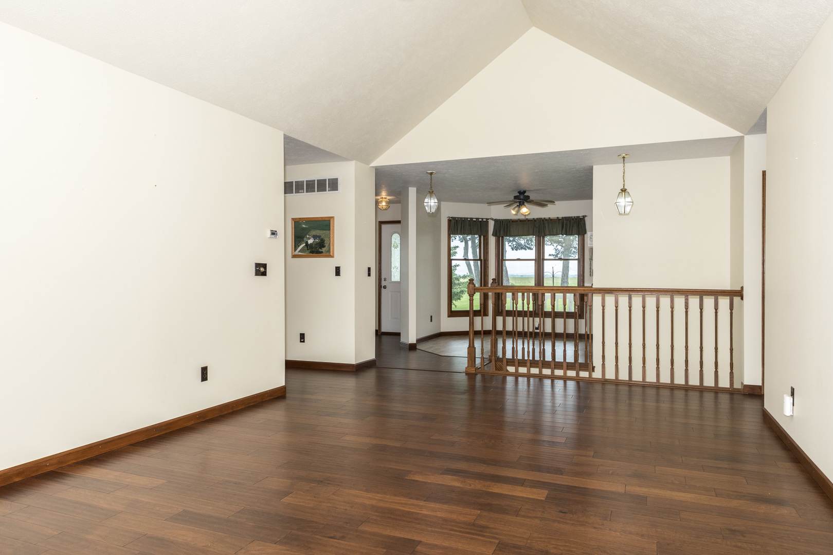 9375 East 3000 N Road Cornell, IL 61319 - Photo 12 of 39 an empty room with wooden floor and windows