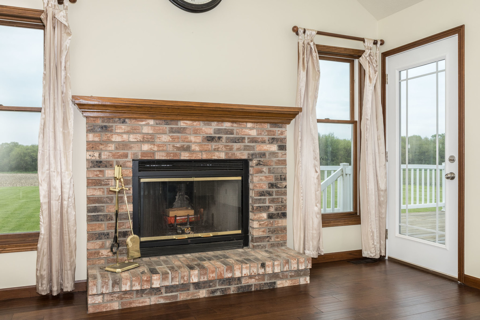 9375 East 3000 N Road Cornell, IL 61319 - Photo 13 of 39 a living room with a fireplace with wooden floor
