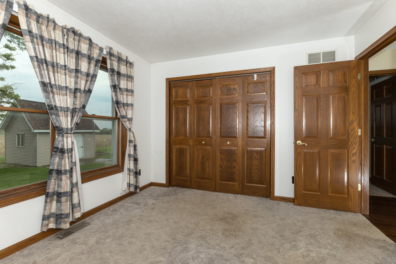 9375 East 3000 N Road Cornell, IL 61319 - Photo 22 of 39 a view of an empty room with floor to ceiling windows