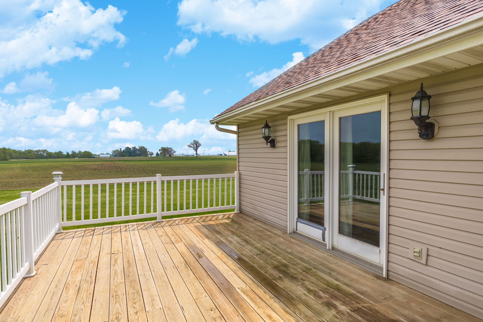 9375 East 3000 N Road Cornell, IL 61319 - Photo 30 of 39 a view of a wooden deck with a yard