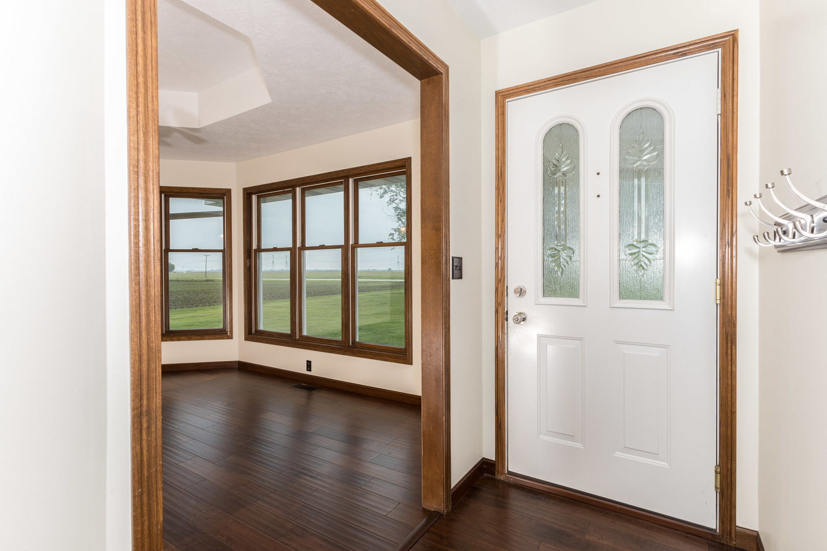 9375 East 3000 N Road Cornell, IL 61319 - Photo 3 of 39 an empty room with wooden floor and windows