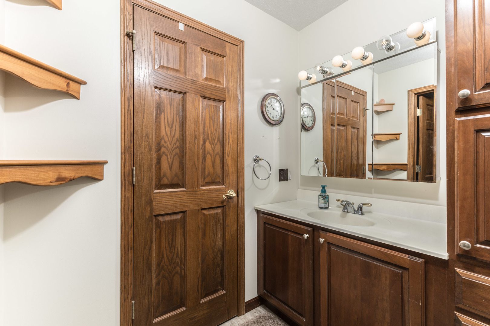 9375 East 3000 N Road Cornell, IL 61319 - Photo 9 of 39 a bathroom with a sink vanity and mirror