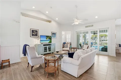 a bedroom with a bed couch and window
